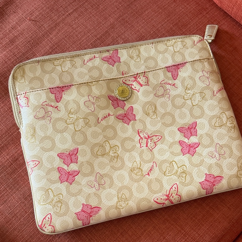 Coach Beige and Pink Butterfly tablet Pouch 11” x 9”.